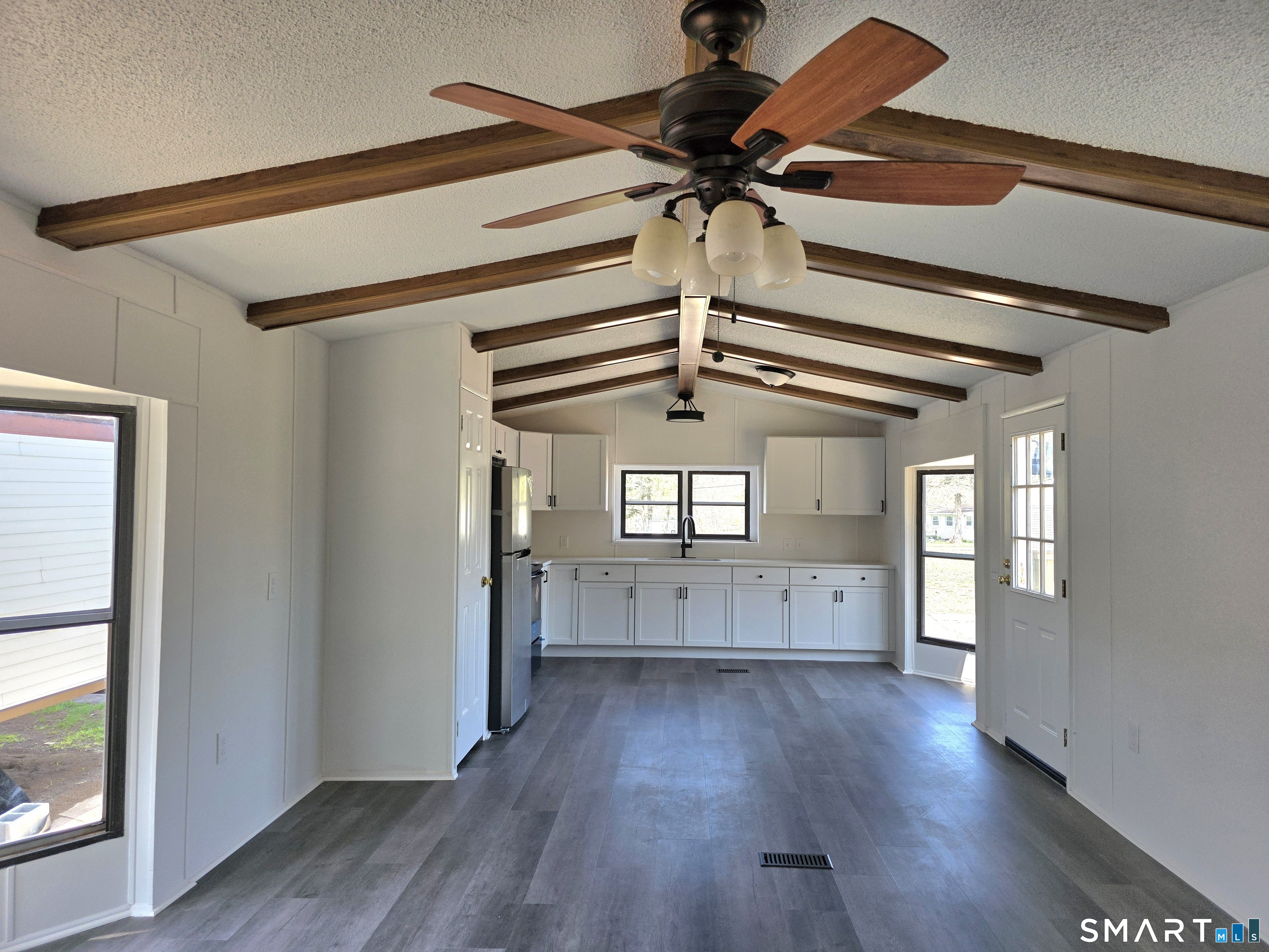 500 Washington Street, Unit 5 Middletown, CT 06457 - Photo 3 of 19 a view of a hallway with wooden floor and chandelier