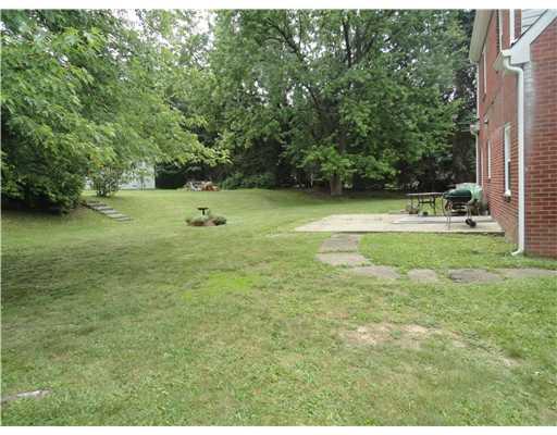 5752 Phillips Road Gibsonia, PA 15044 - Photo 6 of 18 Exterior Back. Patio in back of home. There was an awning over the porch but has been taken down. Breezeway between garage and house leads out onto the patio.