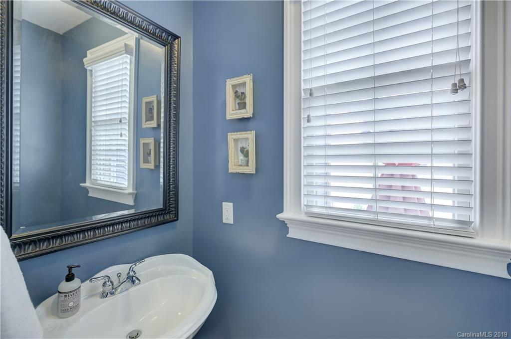 170 Mills Lane, Unit 761 Fort Mill, SC 29708 - Photo 15 of 35 a bathroom with a sink a window and a mirror