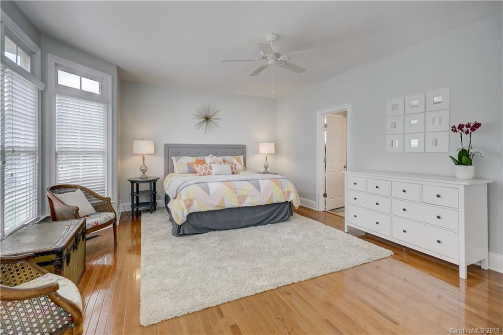 170 Mills Lane, Unit 761 Fort Mill, SC 29708 - Photo 18 of 35 a bedroom with a bed a table and chair