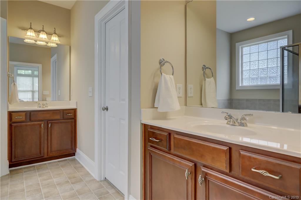 170 Mills Lane, Unit 761 Fort Mill, SC 29708 - Photo 20 of 35 a bathroom with a sink and a mirror