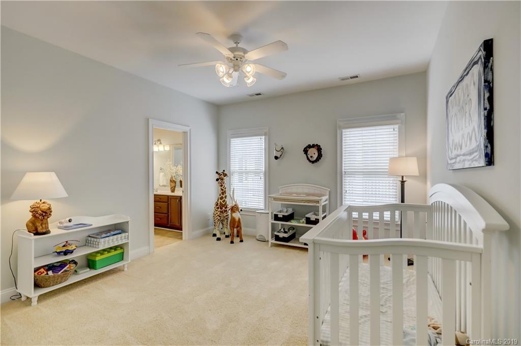 170 Mills Lane, Unit 761 Fort Mill, SC 29708 - Photo 24 of 35 a bedroom with furniture and a large window