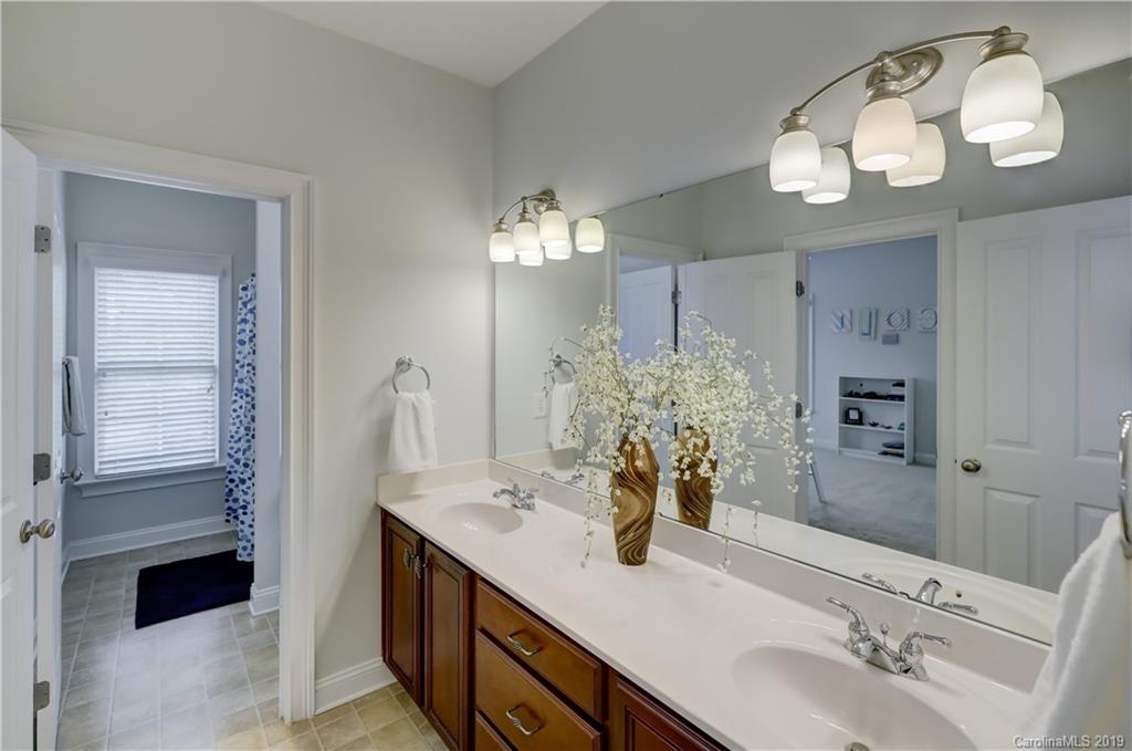 170 Mills Lane, Unit 761 Fort Mill, SC 29708 - Photo 25 of 35 a bathroom with a sink double vanity and a mirror