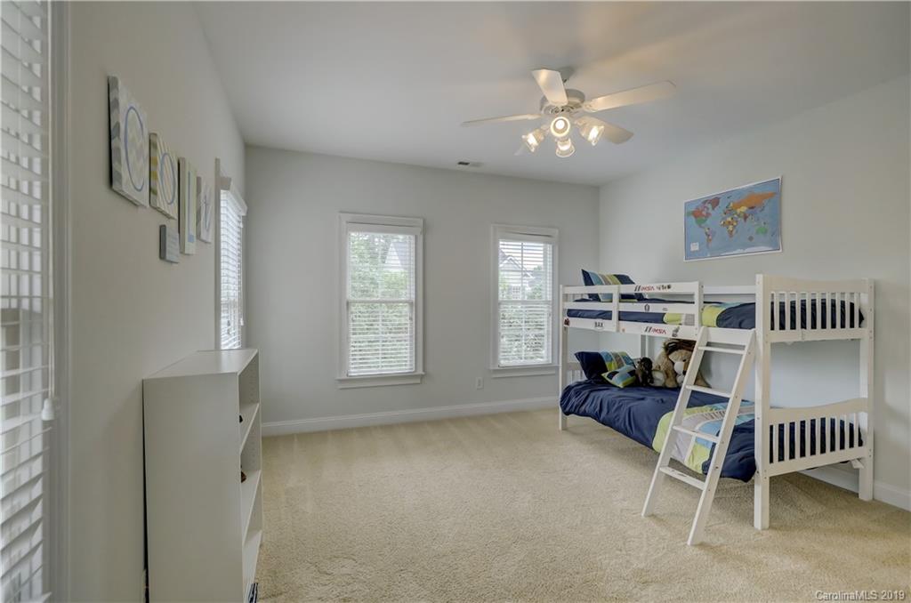 170 Mills Lane, Unit 761 Fort Mill, SC 29708 - Photo 26 of 35 a living room with furniture and a chandelier