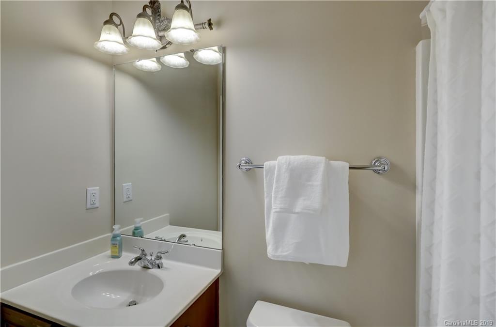 170 Mills Lane, Unit 761 Fort Mill, SC 29708 - Photo 29 of 35 a bathroom with a sink and mirror