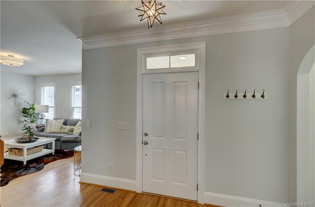 170 Mills Lane, Unit 761 Fort Mill, SC 29708 - Photo 5 of 35 a living room with furniture and a chandelier