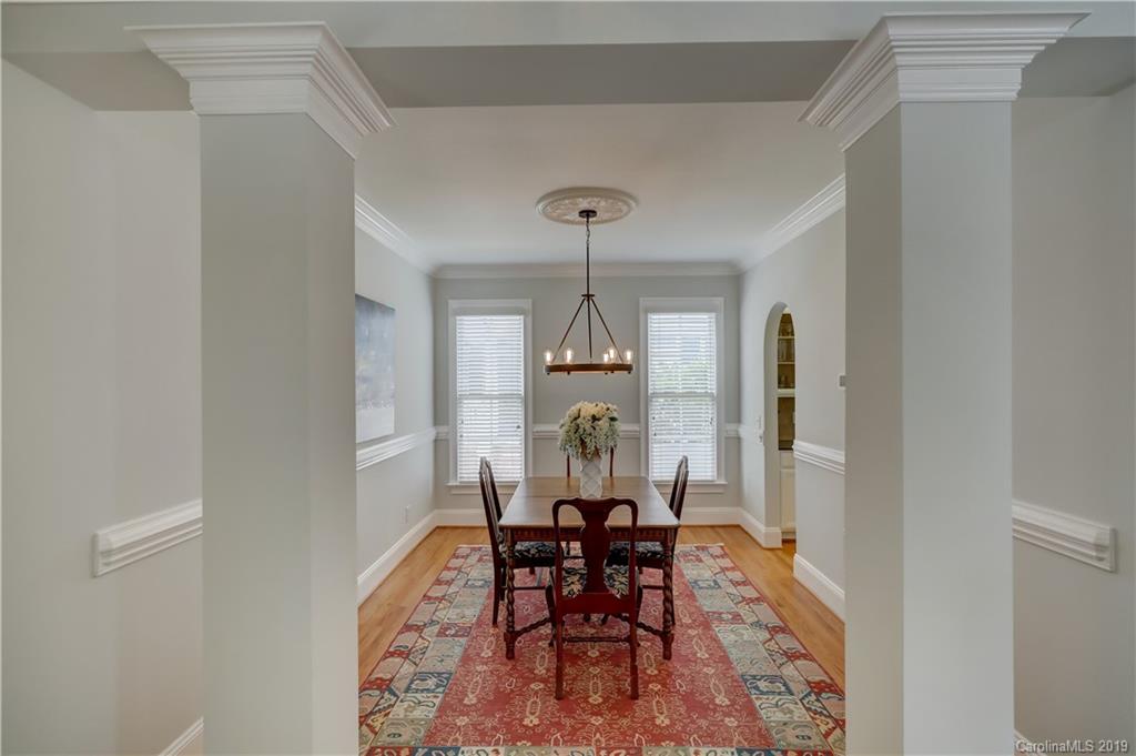 170 Mills Lane, Unit 761 Fort Mill, SC 29708 - Photo 6 of 35 a view of a dining room with furniture window and wooden floor