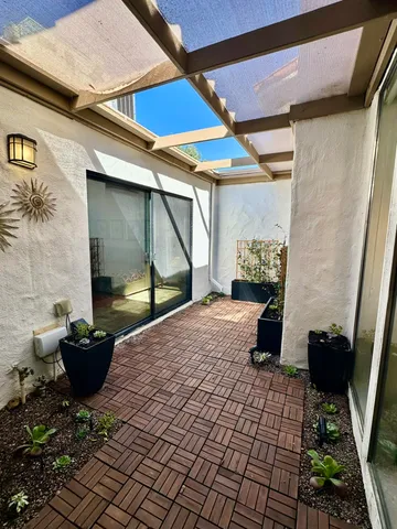 a view of a backyard of a house with sitting area