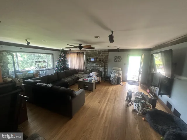 a living room with furniture and a large window