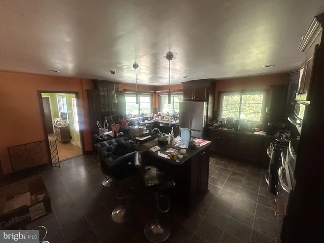 a living room with furniture window and wooden floor