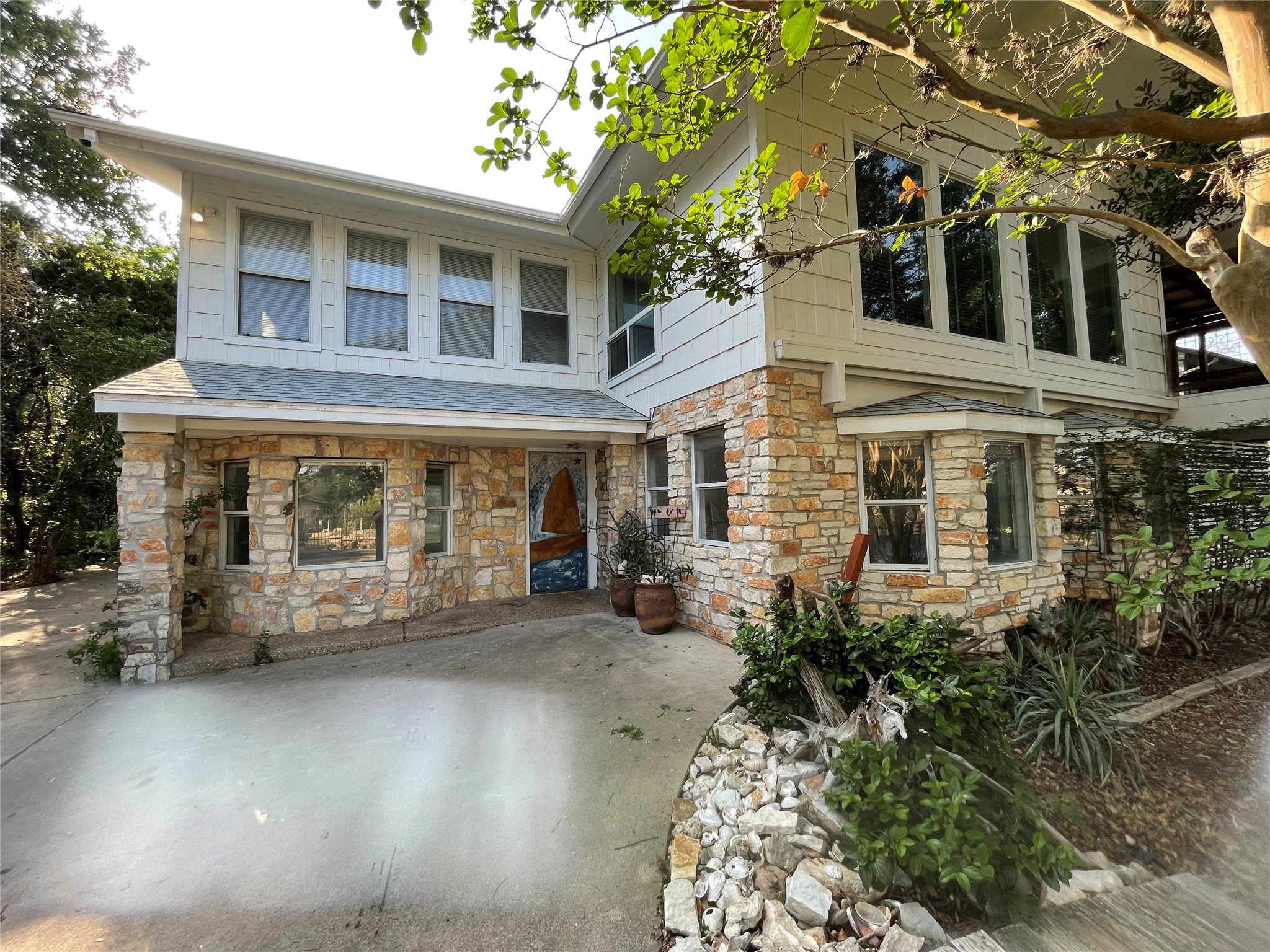 5802 Longhorn Landing Austin, TX 78734 - Photo 11 of 38 View of front of property featuring stone siding