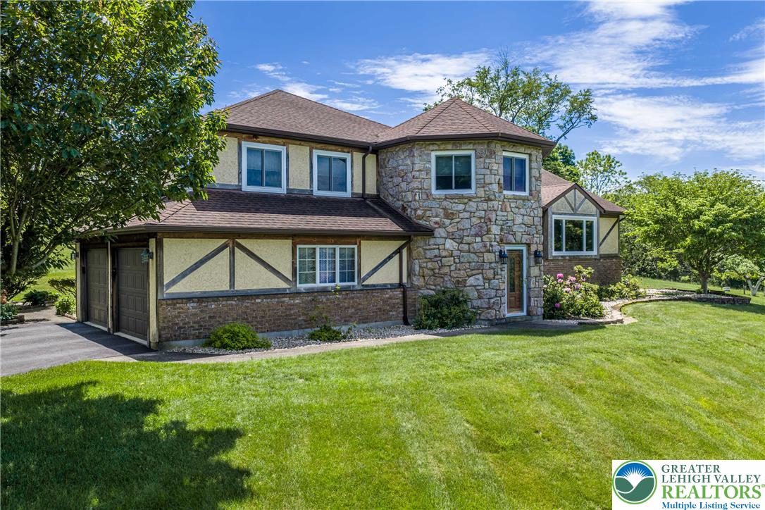 947 Tamenend Road Bath, PA 18014 - Photo 35 of 61 Elegant stone and timber-accented residence with mature landscaping and an inviting entry.