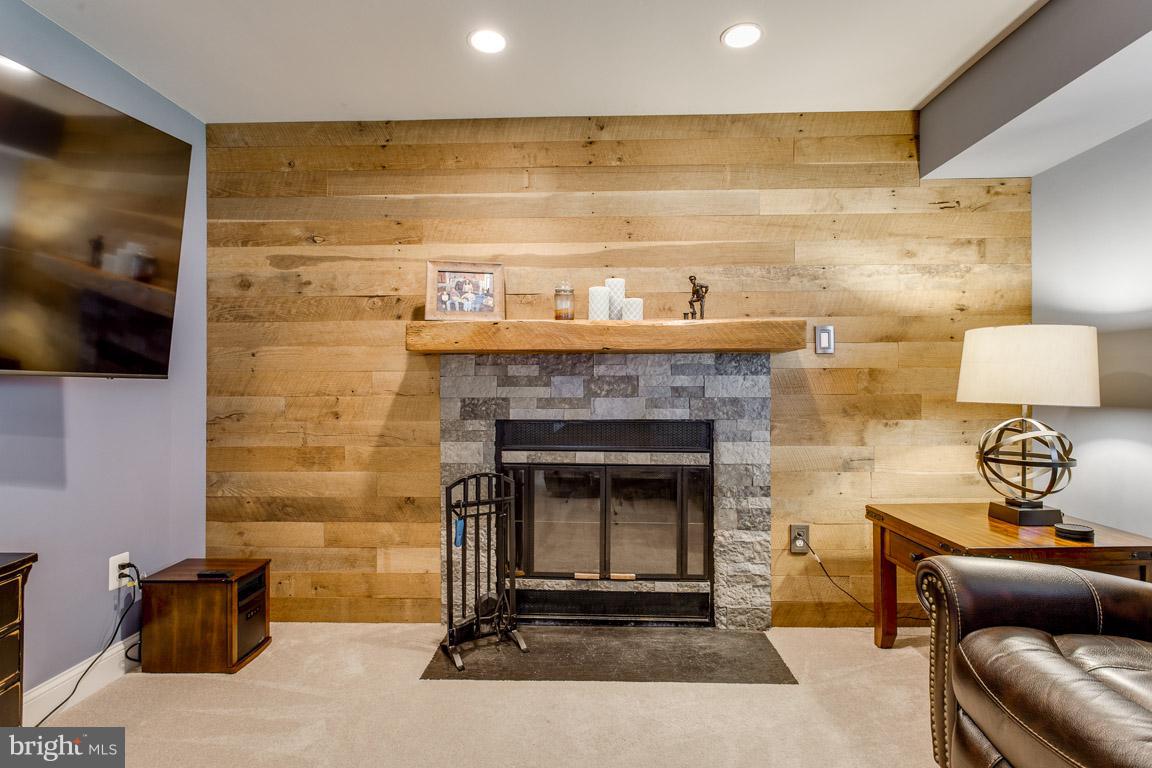4338 Cub Run Road Chantilly, VA 20151 - Photo 19 of 27 Reclaimed oak wood wall w/stone veneer fireplace