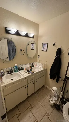 a room with a sink and a mirror