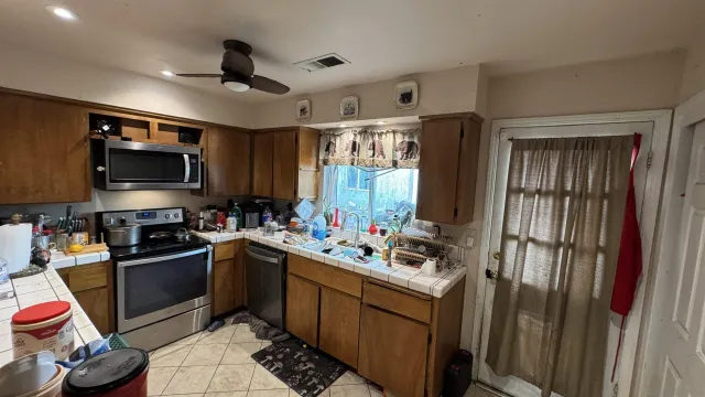a kitchen with a sink stove and microwave