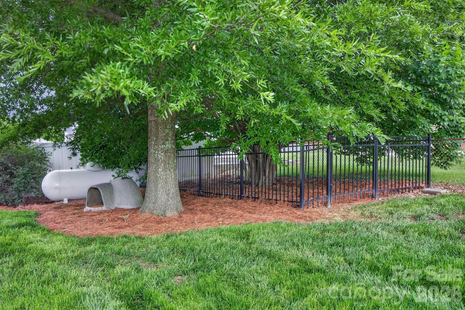 1016 Raney Street Salisbury, NC 28146 - Photo 29 of 45 a wooden bench sitting in the middle of a park