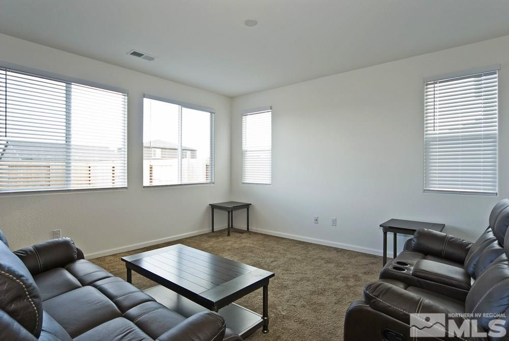 9266 Atoll Drive Reno, NV 89506 - Photo 10 of 23 a living room with furniture and a window