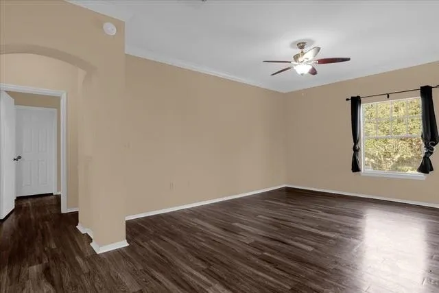 a view of room with hardwood floor and window