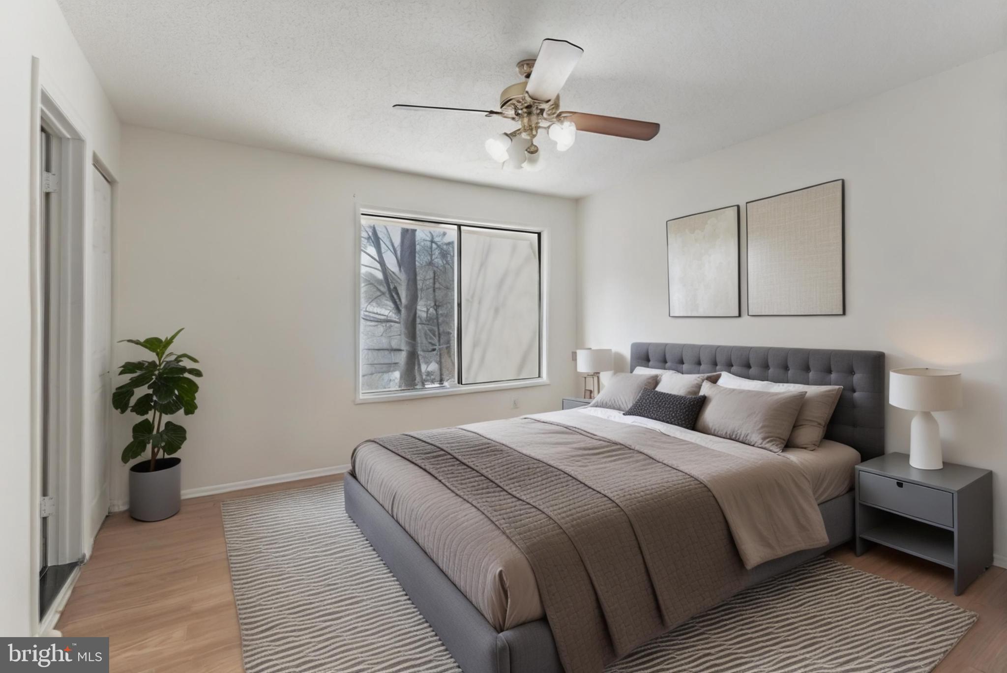 2412 Southgate Square Reston, VA 20191 - Photo 11 of 23 a bedroom with bed and a chandelier