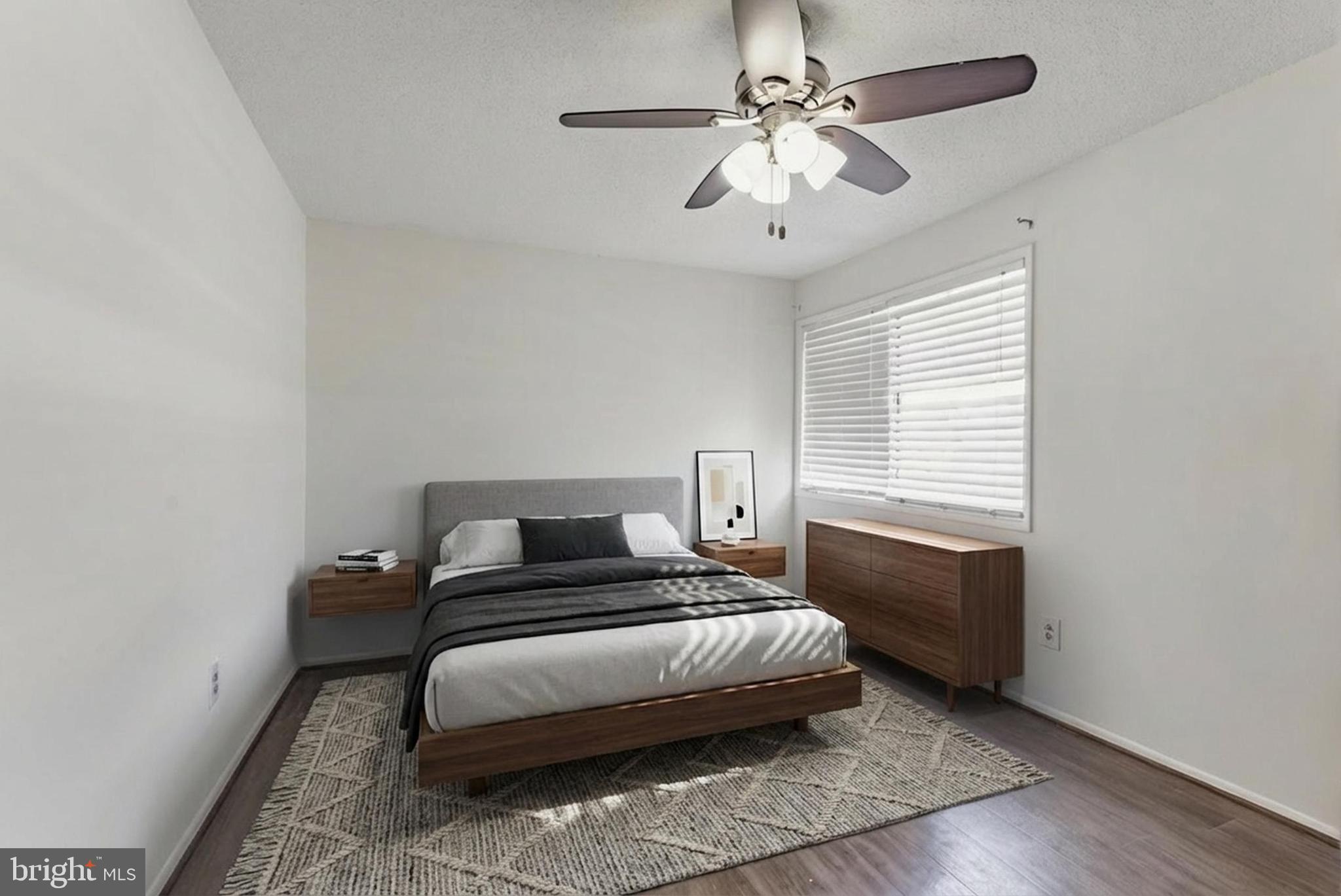 2412 Southgate Square Reston, VA 20191 - Photo 12 of 23 a bedroom with a bed and a ceiling fan