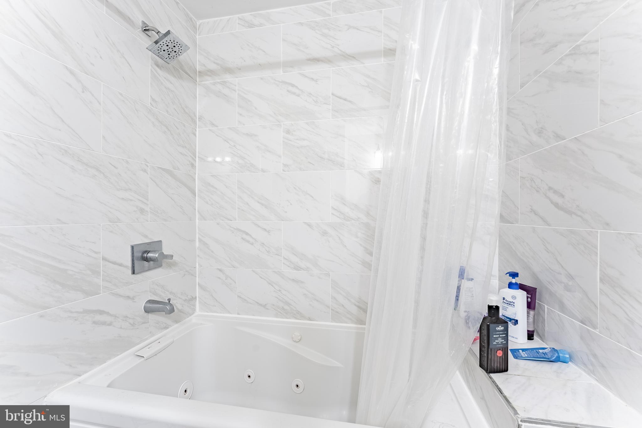 2412 Southgate Square Reston, VA 20191 - Photo 13 of 23 a bathroom with a bathtub