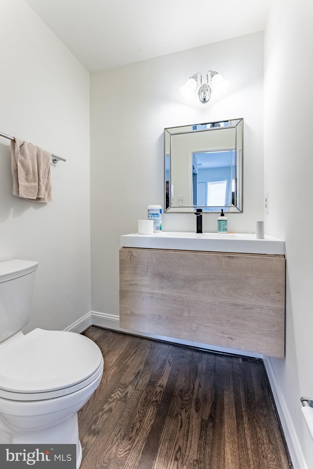 2412 Southgate Square Reston, VA 20191 - Photo 15 of 23 a bathroom with a sink a mirror and a toilet