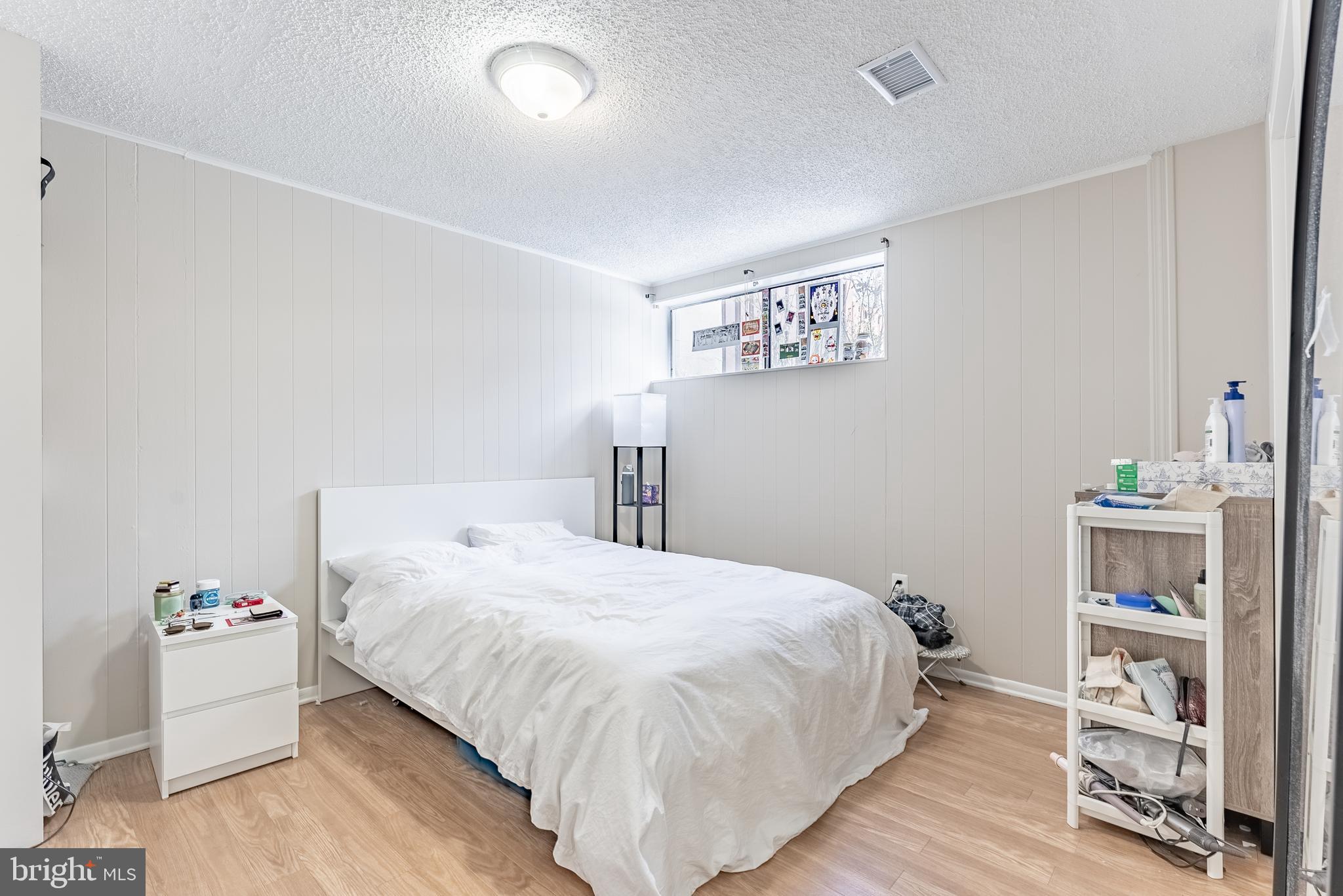 2412 Southgate Square Reston, VA 20191 - Photo 16 of 23 a bedroom with a bed and a wooden floor