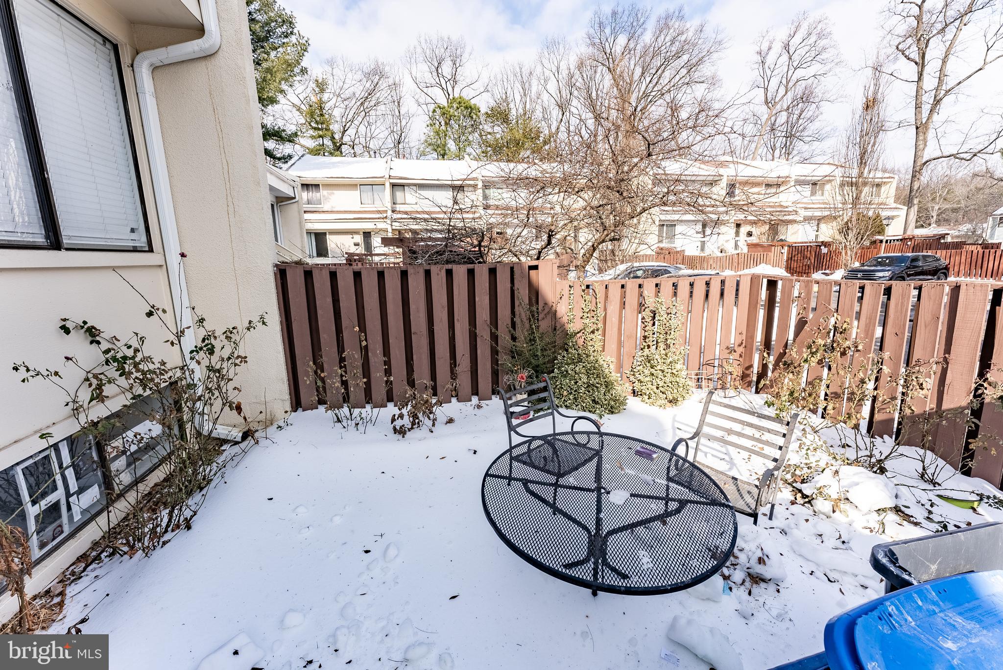 2412 Southgate Square Reston, VA 20191 - Photo 20 of 23 a view of a chairs and table in back yard of the house