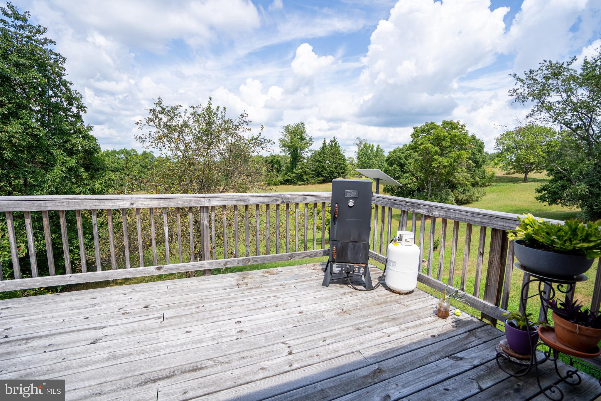 474 Potter Road Hedgesville, WV 25427 - Photo 11 of 40 a view of deck with furniture and trees