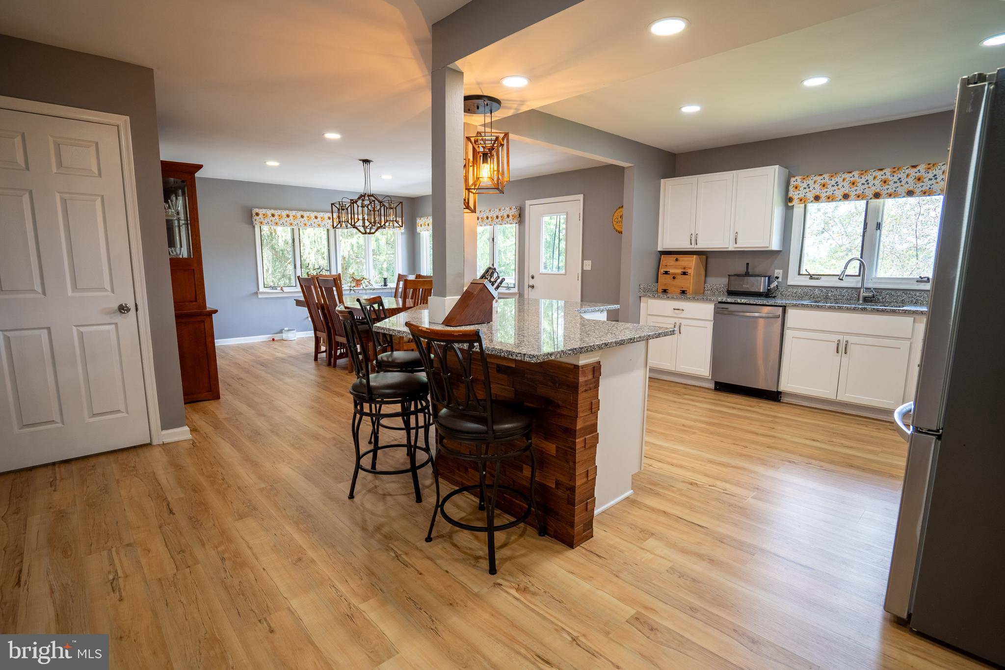 474 Potter Road Hedgesville, WV 25427 - Photo 13 of 40 a view of a dining room with furniture window and wooden floor