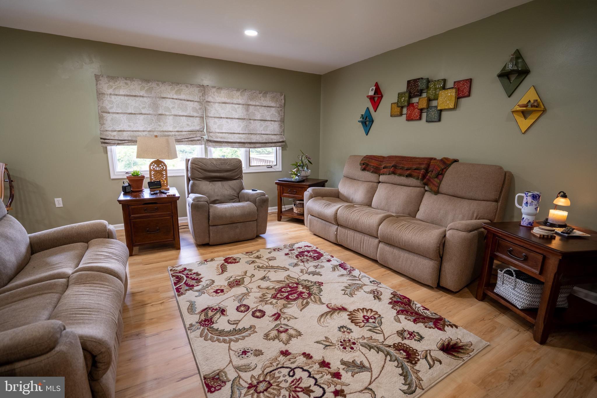 474 Potter Road Hedgesville, WV 25427 - Photo 16 of 40 a living room with furniture and a flat screen tv