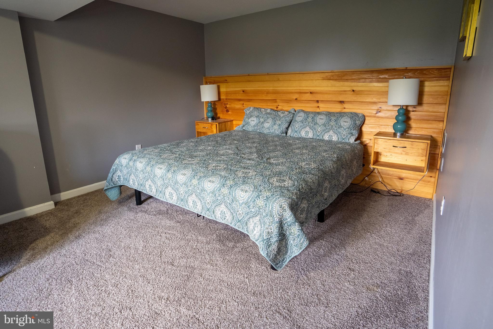 474 Potter Road Hedgesville, WV 25427 - Photo 27 of 40 a bed sitting in a bedroom next to a window