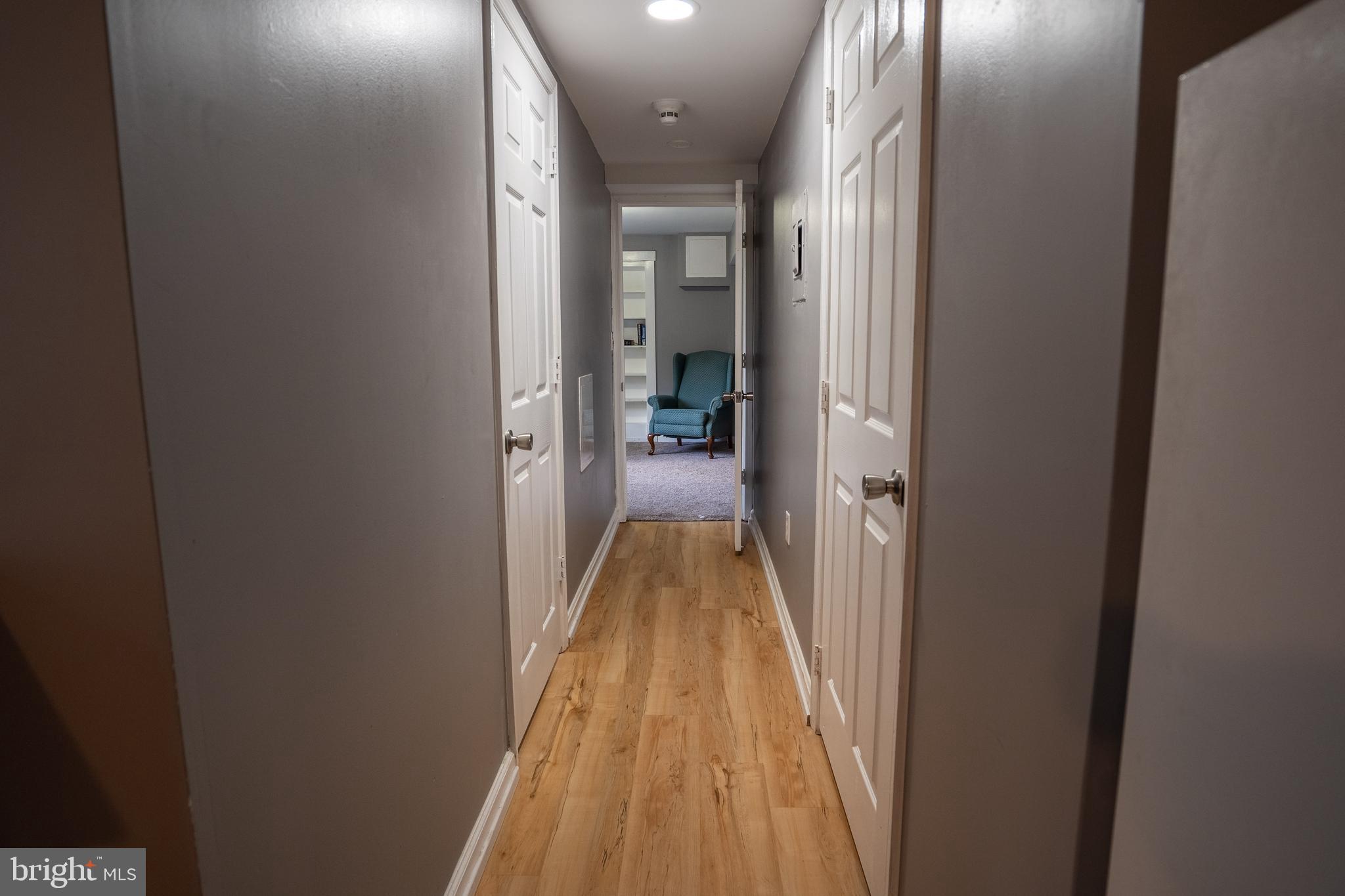 474 Potter Road Hedgesville, WV 25427 - Photo 28 of 40 a view of a hallway with a livingroom and furniture