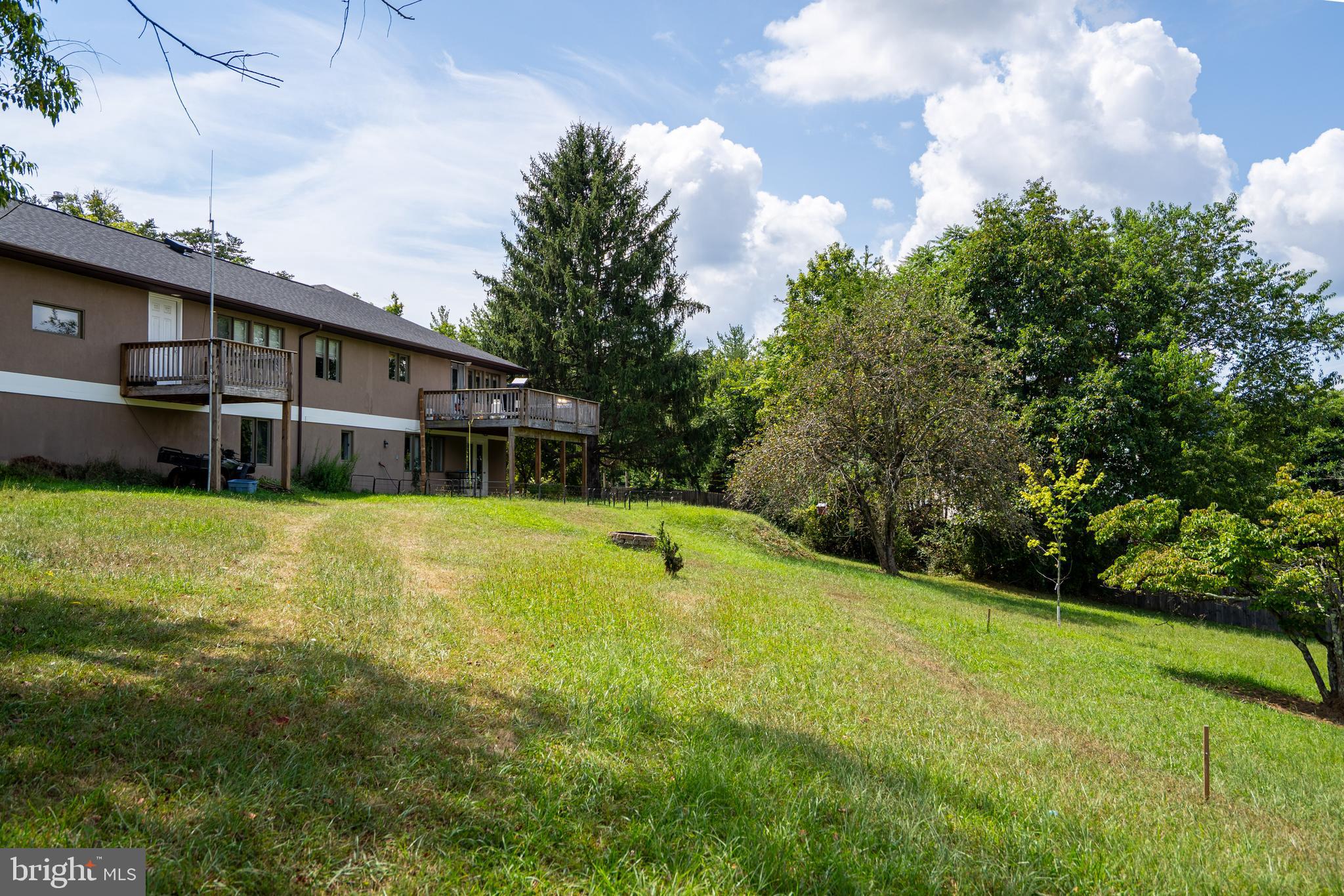 474 Potter Road Hedgesville, WV 25427 - Photo 36 of 40 a view of a house with a yard