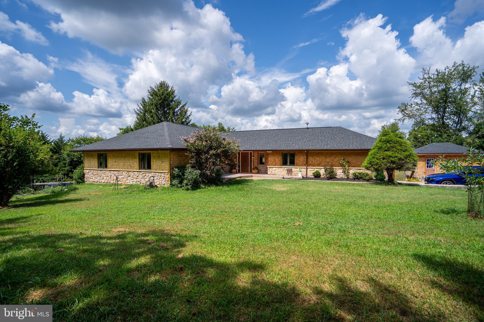474 Potter Road Hedgesville, WV 25427 - Photo 40 of 40 a front view of a house with garden