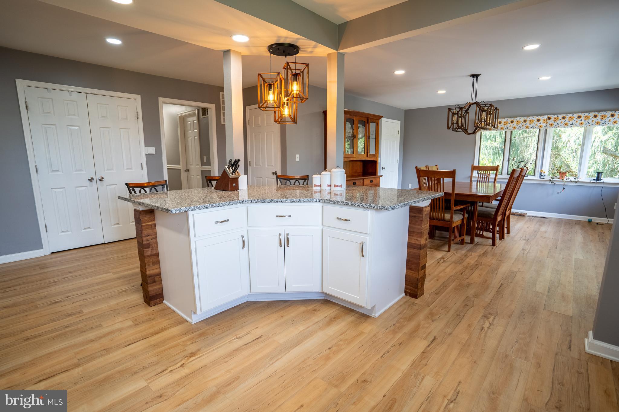 474 Potter Road Hedgesville, WV 25427 - Photo 5 of 40 a kitchen with stainless steel appliances granite countertop wooden floors and white walls