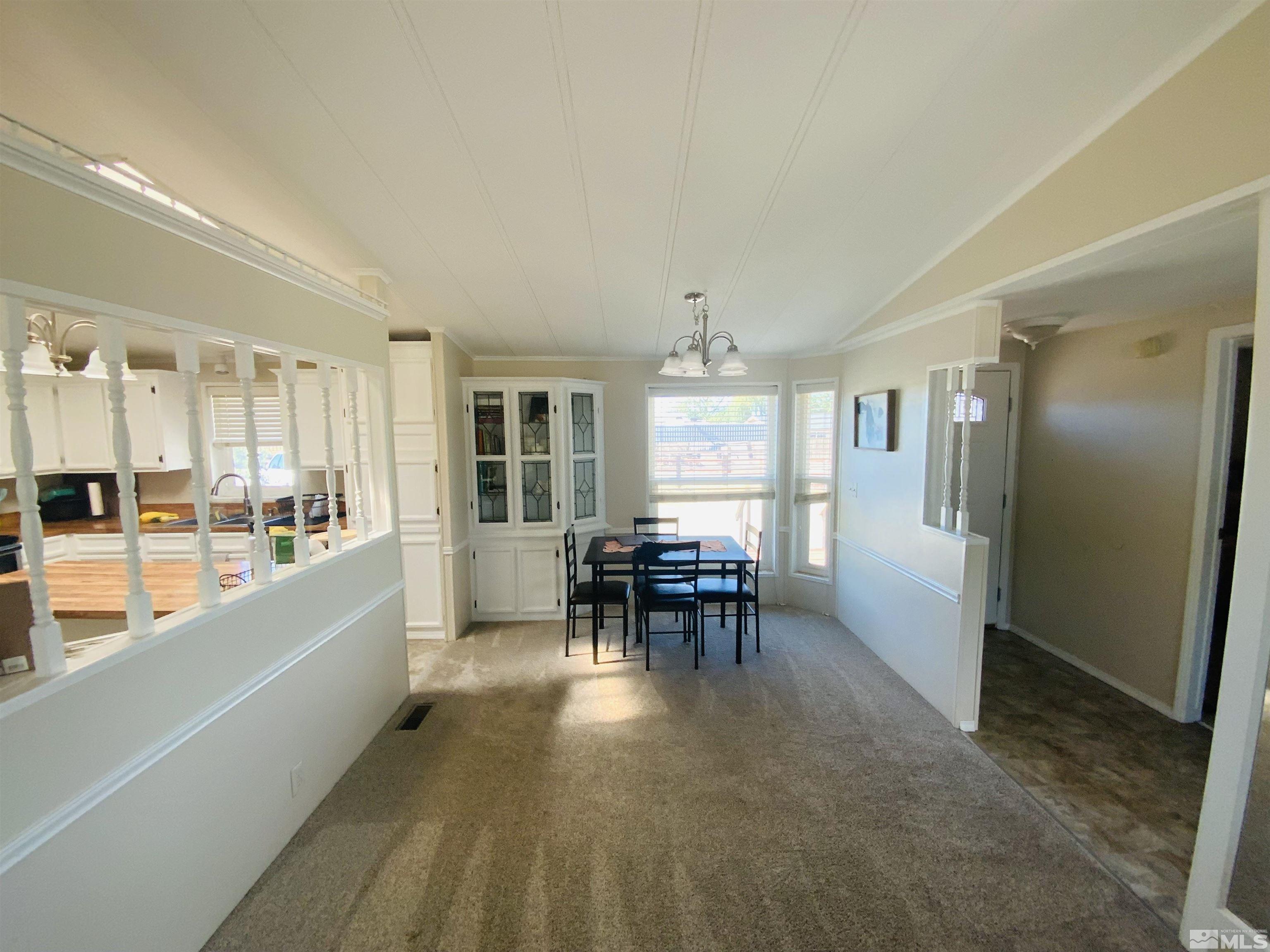 2140 Soda Lake Road Fallon, NV 89406 - Photo 4 of 22 a view of a dining room with furniture window and wooden floor
