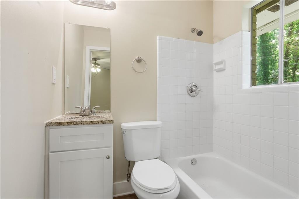 4505 Wonder Valley Trail Decatur, GA 30034 - Photo 24 of 34 a bathroom with a granite countertop sink toilet and shower