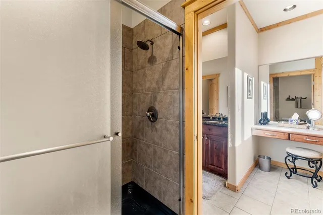 a bathroom with a shower and a sink