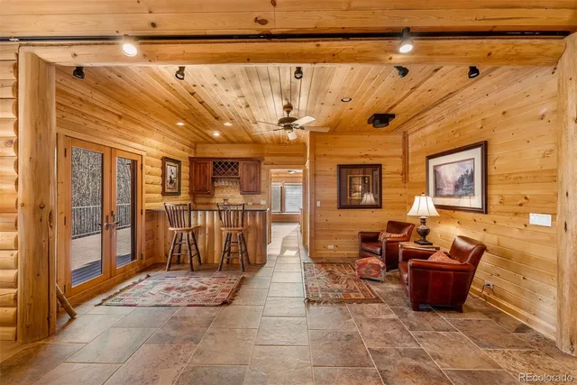 a lobby with furniture and a rug