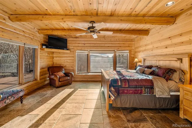 a living room with a couch next to a window