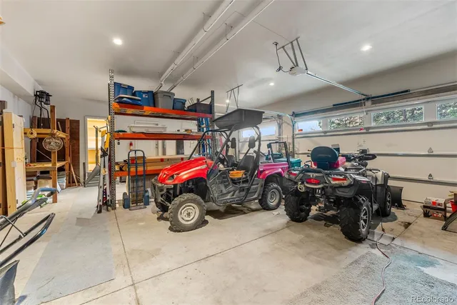 a view of a garage with a bike and car