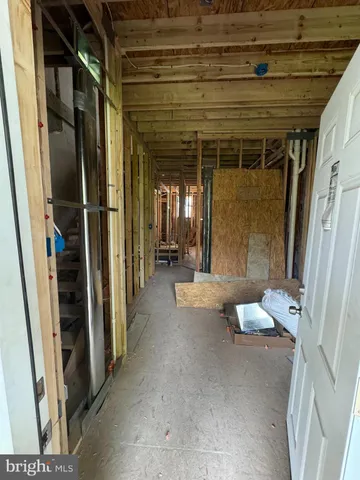 a living room with furniture and a walk in closet