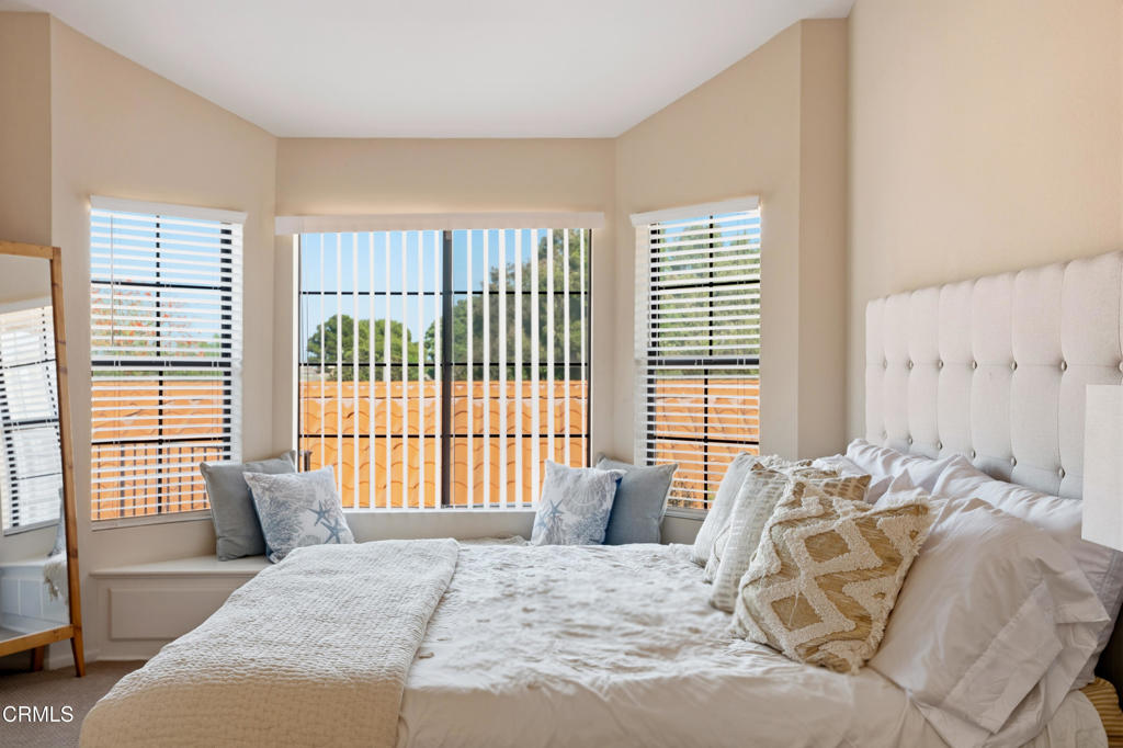 4427 Antigua Way Oxnard, CA 93035 - Photo 16 of 43 a bed sitting in a bedroom next to a window