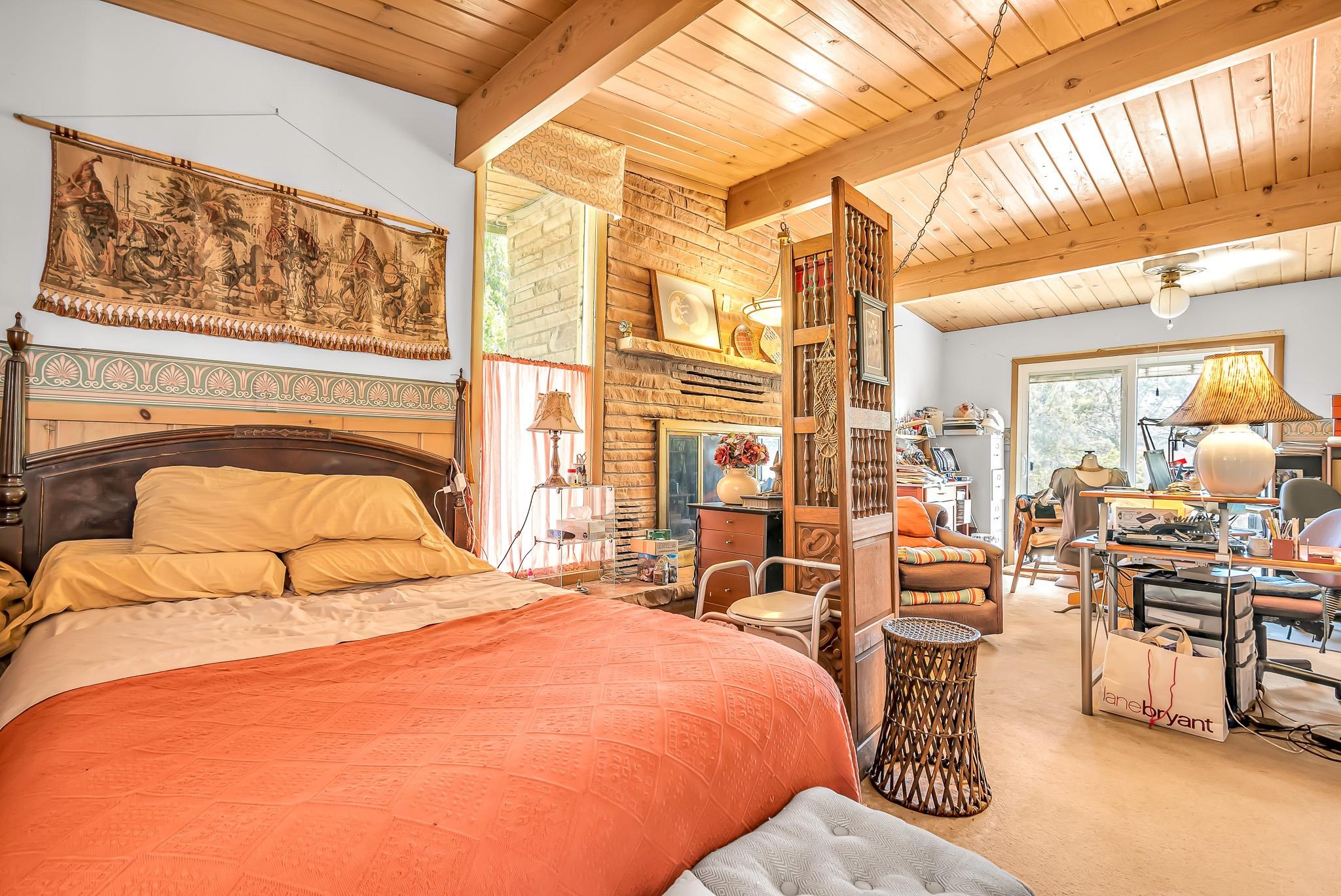 204 Easter Hill Drive Grand Junction, CO 81507 - Photo 13 of 27 a bedroom with furniture and large windows