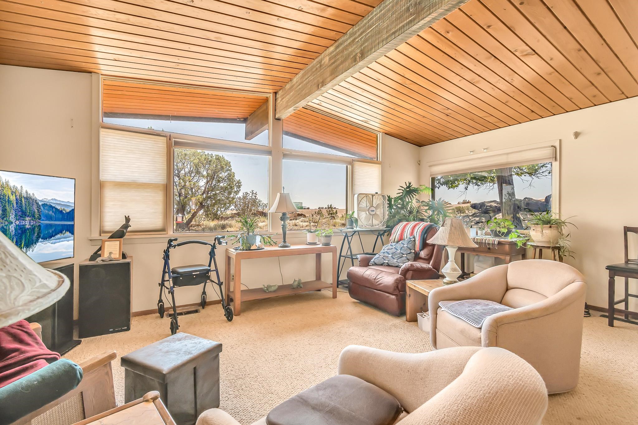 204 Easter Hill Drive Grand Junction, CO 81507 - Photo 3 of 27 a living room with furniture and a large window