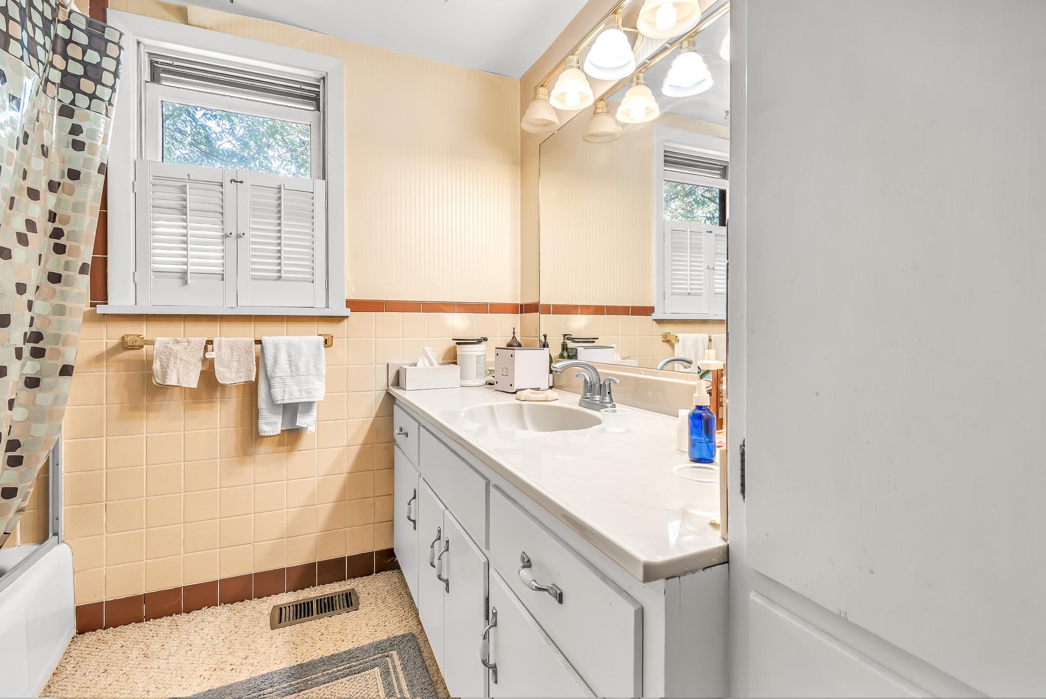 204 Easter Hill Drive Grand Junction, CO 81507 - Photo 10 of 27 a bathroom with a sink a vanity and a mirror