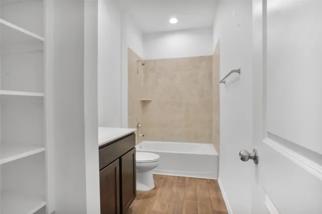 a bathroom with a bathtub toilet and a shower