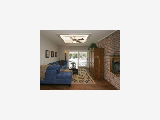1445 Brookmill Road Los Altos, CA 94024 - Photo 6 of 9 a living room with furniture and a fireplace