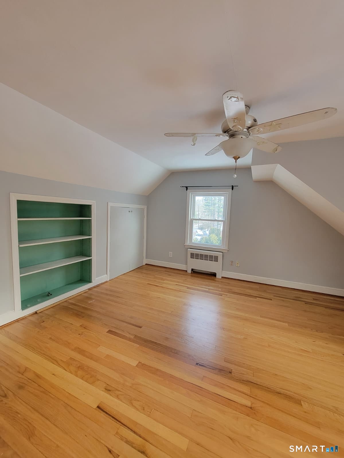 895 Pleasant Valley Road South Windsor, CT 06074 - Photo 12 of 15 a view of empty room with wooden floor and fan